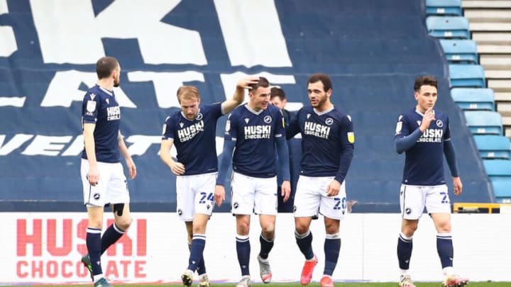 LONDON, ENGLAND - MARCH 20: The Millwall squad celebrate after Grant Hall of Middlesbrough (not pictured) scores an own goal during the Sky Bet Championship match between Millwall and Middlesbrough at The Den on March 20, 2021 in London, England. Sporting stadiums around the UK remain under strict restrictions due to the Coronavirus Pandemic as Government social distancing laws prohibit fans inside venues resulting in games being played behind closed doors. (Photo by Jacques Feeney/Getty Images)