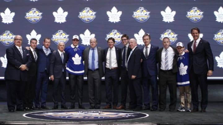 Jun 24, 2016; Buffalo, NY, USA; Auston Matthews poses for a photo with team officials after being selected as the number one overall draft pick by the Toronto Maple Leafs in the first round of the 2016 NHL Draft at the First Niagra Center. Mandatory Credit: Timothy T. Ludwig-USA TODAY Sports