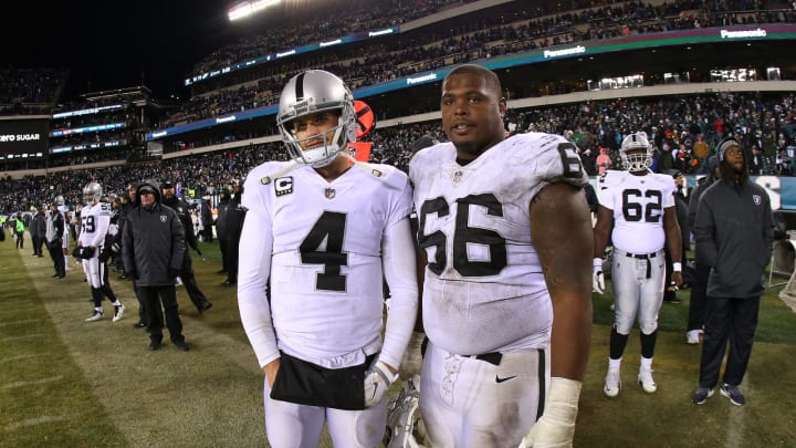 PHILADELPHIA, PA – DECEMBER 25: Derek Carr #4 and Gabe Jackson #66 of the Oakland Raiders stand on the sidelines as the Philadelphia Eagles celebrate their 19-10 win at Lincoln Financial Field on December 25, 2017 in Philadelphia, Pennsylvania. (Photo by Rich Schultz/Getty Images)