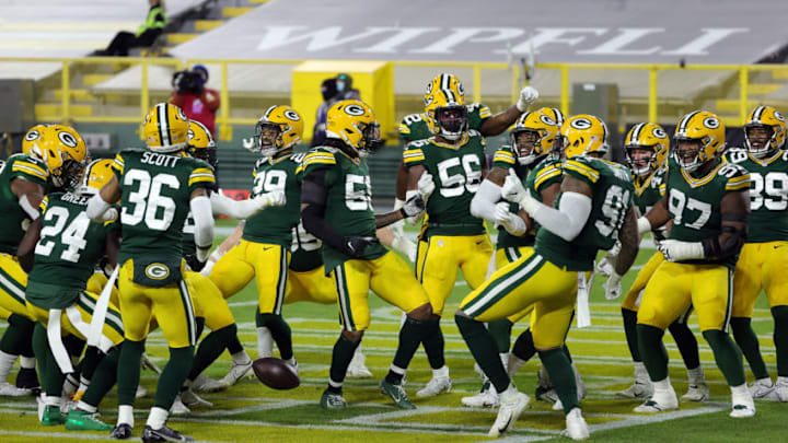 GREEN BAY, WISCONSIN - NOVEMBER 29: Players dance and surround Preston Smith #91 of the Green Bay Packers in the end zone after Smith recovered a fumble and ran it back for a touchdown during the 1st half of the game against the Chicago Bears at Lambeau Field on November 29, 2020 in Green Bay, Wisconsin. (Photo by Stacy Revere/Getty Images)