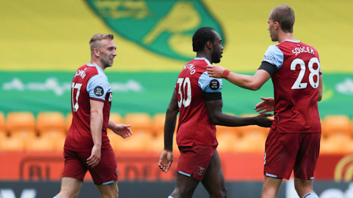 NORWICH, ENGLAND - JULY 11: Michail Antonio of West Ham United celebrates with teammates Jarrod Bowen and Tomas Soucek after scoring his team's third goal, his hattrick, during the Premier League match between Norwich City and West Ham United at Carrow Road on July 11, 2020 in Norwich, England. Football Stadiums around Europe remain empty due to the Coronavirus Pandemic as Government social distancing laws prohibit fans inside venues resulting in all fixtures being played behind closed doors. (Photo by Ian Walton/Pool via Getty Images)