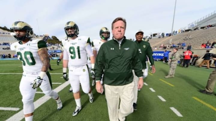 Nov 28, 2014; Colorado Springs, CO, USA; Colorado State Rams head coach Jim McElwain walks out onto Falcon Stadium with tight end Steven Walker (30) and defensive lineman Jakob Buys (91) before the start of the game against the Air Force Falcons. Mandatory Credit: Ron Chenoy-USA TODAY Sports