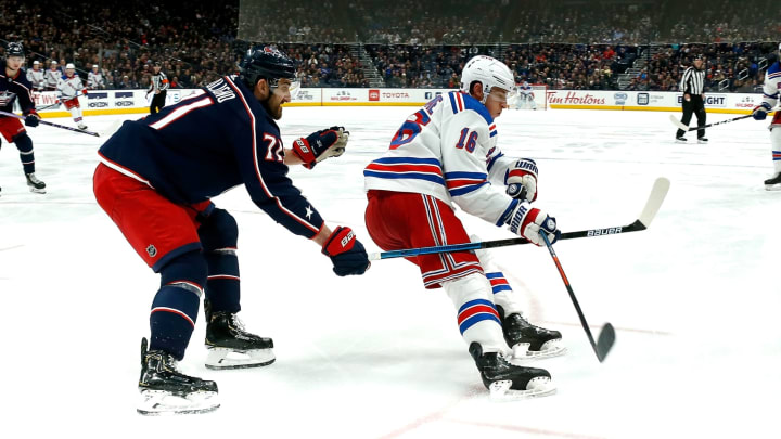 COLUMBUS, OH – DECEMBER 5: Ryan Strome #16 of the New York Rangers flips the puck past Nick Foligno #71 of the Columbus Blue Jackets during the game on December 5, 2019 at Nationwide Arena in Columbus, Ohio. New York defeated Columbus 3-2. (Photo by Kirk Irwin/Getty Images)