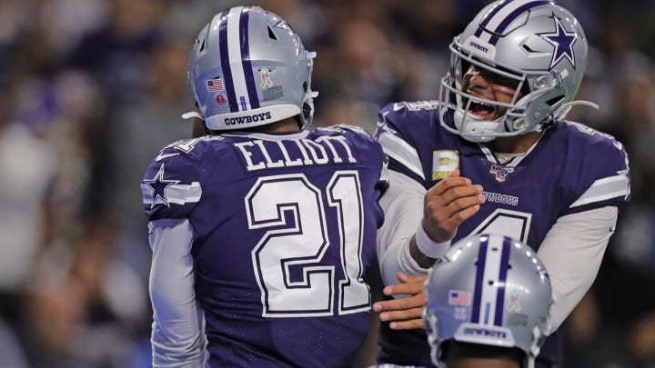 DETROIT, MI – NOVEMBER 17: Ezekiel Elliott #21 and Dak Prescott #4 of the Dallas Cowboys celebrates a fourth quarter touchdown during the game against the Detroit Lions at Ford Field on November 17, 2019 in Detroit, Michigan. Dallas defeated Detroit 35-27. (Photo by Leon Halip/Getty Images)