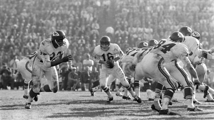 Jan 15, 1967; Los Angeles, CA, USA; FILE PHOTO; Kansas City Chiefs quarterback Len Dawson (16) drops back to pass while fullback Curtis McClinton (32) runs a pass pattern against the Green Bay Packers during Super Bowl I at the Los Angeles Coliseum. The Packers beat the Chiefs 35-10. Mandatory Credit: Rod Hanna-USA TODAY Sports