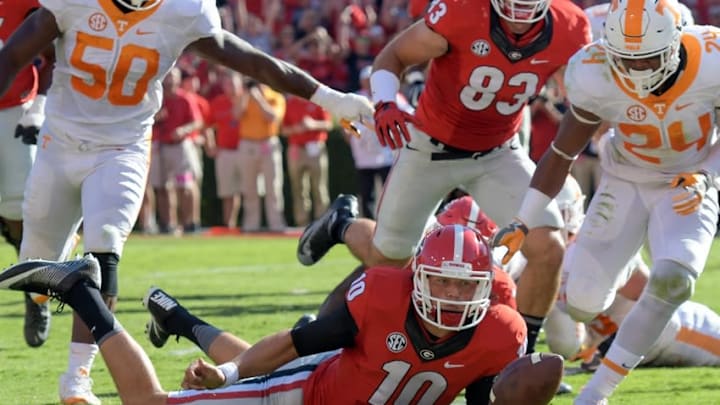 Oct 1, 2016; Athens, GA, USA; Georgia Bulldogs quarterback Jacob Eason (10) recovers a fumble by running back Sony Michel (not shown) for a Georgia touchdown against the Tennessee Volunteers during the second quarter at Sanford Stadium. Mandatory Credit: Dale Zanine-USA TODAY Sports