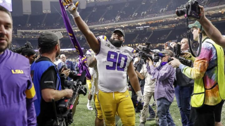 NEW ORLEANS, LA - JANUARY 13: Defensive Tackle Rashard Lawrence #90 of the LSU Tigers wave to the fans as he leaves the field after the College Football Playoff National Championship game against the Clemson Tigers at the Mercedes-Benz Superdome on January 13, 2020 in New Orleans, Louisiana. LSU defeated Clemson 42 to 25. (Photo by Don Juan Moore/Getty Images)