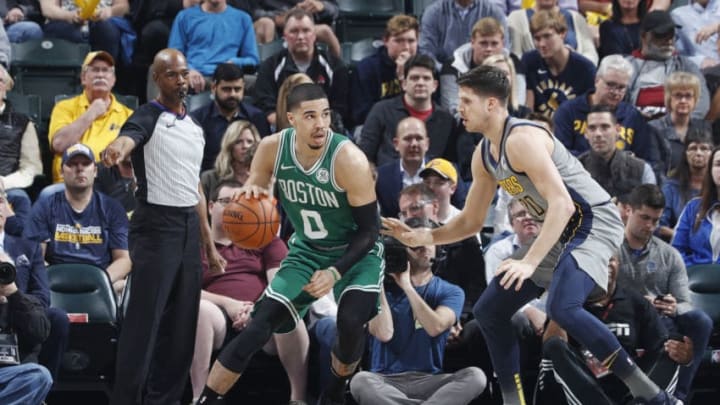 INDIANAPOLIS, IN - APRIL 05: Jayson Tatum #0 of the Boston Celtics looks to the basket against Doug McDermott #20 of the Indiana Pacers in the first half of a game at Bankers Life Fieldhouse on April 5, 2019 in Indianapolis, Indiana. NOTE TO USER: User expressly acknowledges and agrees that, by downloading and or using the photograph, User is consenting to the terms and conditions of the Getty Images License Agreement. (Photo by Joe Robbins/Getty Images)