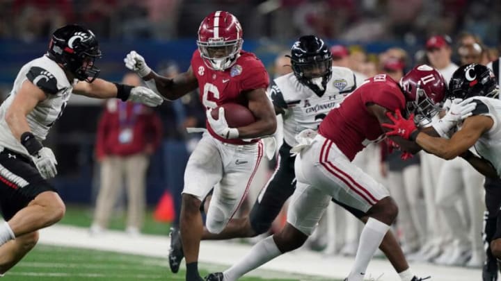 Alabama running back Trey Sanders (6) follows a block by Alabama wide receiver Traeshon Holden (11) as he runs the ball against Cincinnati during the 2021 College Football Playoff Semifinal game at the 86th Cotton Bowl in AT&T Stadium in Arlington, Texas Friday, Dec. 31, 2021. Alabama defeated Cincinnati 27-6 to advance to the national championship game. [Staff Photo/Gary Cosby Jr.]College Football Playoffs Alabama Vs Cincinnati
