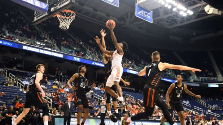 GREENSBORO, NORTH CAROLINA - MARCH 11: John Newman III #15 of the Clemson Tigers attempts a shot against the Miami Hurricanes during their game in the second round of the 2020 Men's ACC Basketball Tournament at Greensboro Coliseum on March 11, 2020 in Greensboro, North Carolina. (Photo by Jared C. Tilton/Getty Images)