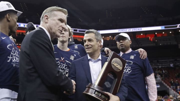 LOUISVILLE, KY - MARCH 30: Head coach Tony Bennett of the Virginia Cavaliers accepts the South Regional championship trophy after defeating the Purdue Boilermakers in the Elite Eight round of the 2019 NCAA Men's Basketball Tournament held at KFC YUM! Center on March 30, 2019 in Louisville, Kentucky. (Photo by Joe Robbins/NCAA Photos/NCAA Photos via Getty Images)