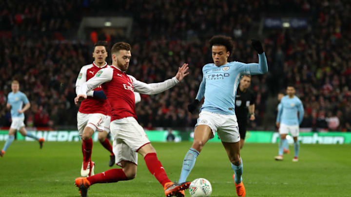 LONDON, ENGLAND - FEBRUARY 25: Calum Chambers of Arsenal tackles Leroy Sane of Manchester City during the Carabao Cup Final between Arsenal and Manchester City at Wembley Stadium on February 25, 2018 in London, England. (Photo by Catherine Ivill/Getty Images)