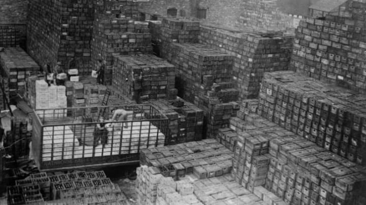 Workmen unloading crates of beer stacked at a New York brewery shortly after the repeal of Prohibition.