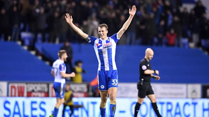 WIGAN, ENGLAND – FEBRUARY 19: Dan Burn of Wigan Athletic celebrates on the final whistle after the Emirates FA Cup Fifth Round match between Wigan Athletic and Manchester City at DW Stadium on February 19, 2018 in Wigan, England. (Photo by Gareth Copley/Getty Images)