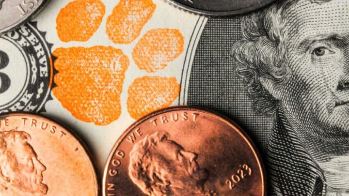 Clemson football fans put money into traveled city revenues, and it started in 1977 in Atlanta. The tradition of fans bringing their orange stamped two-dollar bills lives on.