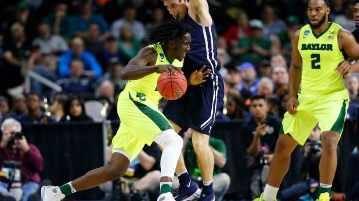 Mar 17, 2016; Providence, RI, USA; Baylor Bears forward Taurean Prince (21) drives past Yale Bulldogs guard Nick Victor (21) during the first half of a first round game of the 2016 NCAA Tournament at Dunkin Donuts Center. Mandatory Credit: Winslow Townson-USA TODAY Sports