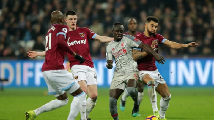 LONDON, ENGLAND - FEBRUARY 04: Sadio Mane of Liverpool battles for possession with Ryan Fredericks of West Ham United during the Premier League match between West Ham United and Liverpool FC at London Stadium on February 04, 2019 in London, United Kingdom. (Photo by Richard Heathcote/Getty Images)