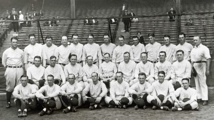 The New York Yankees, winner of the 1927 pennant in the American league. Bottom row, left to right, are: pitcher Dutch Ruether, infielder Joe Dugan, outfielder Ben Paschal, catcher Benny Bengough, pitcher Myles Thomas, infielder Mike Gazella, infielder Ray Morehart, Bennett (mascot). Middle row, left to right: pitcher Bob Shawkey, pitcher Joe Giard, catcher Johnny Grabowski, O’Leary, Miller, Miller Huggins (manager), Fletcher, pitcher Herb Pennock, infielder Julie Wera, catcher Pat Collins. Top row, left to right: first baseman Lou Gehrig, outfielder Bob Meusel, outfielder Babe Ruth, pitcher Wilcy Moore, pitcher George Pipgras, Outfielder Earle Combs, Miller, pitcher Waite Hoyt, infielder Tony Lazzeri, infielder Mark Koenig, pitcher Urban Shocker, outfielder Cedric Durst, and Doc. Woods (trainer). (Photo by George Rinhart/Corbis via Getty Images)