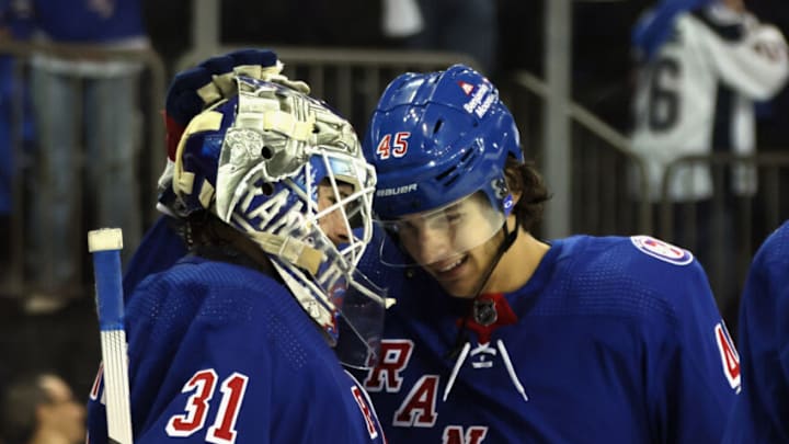NEW YORK, NEW YORK - MAY 28: Igor Shesterkin #31 and Braden Schneider #45 of the New York Rangers celebrate their 5-2 victory over the Carolina Hurricanes in Game Six of the Second Round of the 2022 Stanley Cup Playoffs at Madison Square Garden on May 28, 2022 in New York City. (Photo by Bruce Bennett/Getty Images)