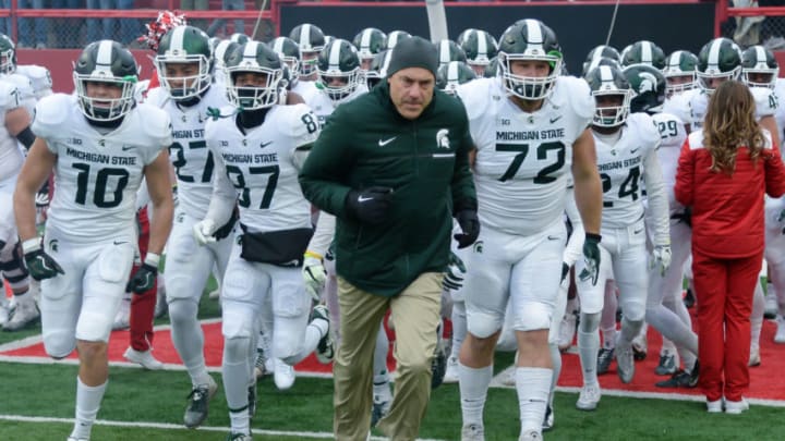 LINCOLN, NE - NOVEMBER 17: Head coach Mark Dantonio of the Michigan State Spartans leads the team on the field before the game against the Nebraska Cornhuskers at Memorial Stadium on November 17, 2018 in Lincoln, Nebraska. (Photo by Steven Branscombe/Getty Images)
