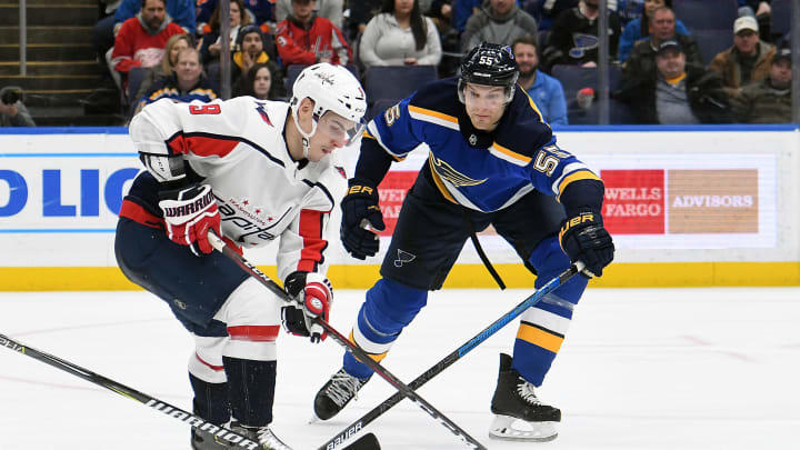 ST. LOUIS, MO. – JANUARY 03: St. Louis Blues defenseman Colton Parayko (55) reaches in to get the puck from Washington Capitals defenseman Dimitry Orlov (9) during an NHL game between the Washington Capitals and the St. Louis Blues on January 03, 2019, at Enterprise Center, St. Louis, MO. (Photo by Keith Gillett/Icon Sportswire via Getty Images)