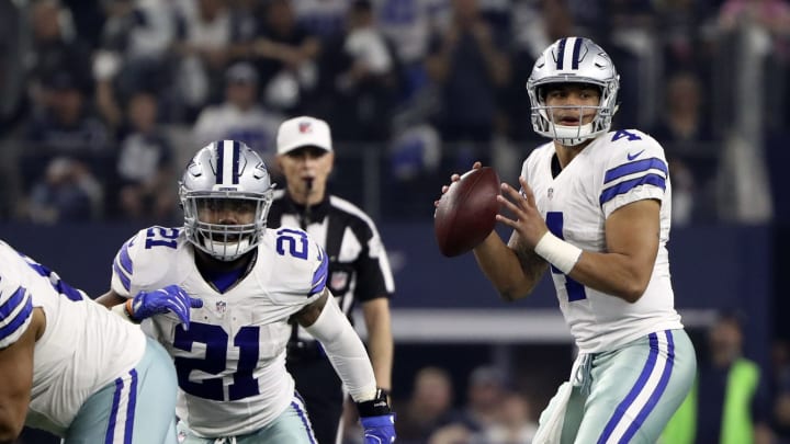 Jan 15, 2017; Arlington, TX, USA; Dallas Cowboys quarterback Dak Prescott (4) throws as running back Ezekiel Elliott (21) blocks during the game against the Green Bay Packers in the NFC Divisional playoff game at AT&T Stadium. Mandatory Credit: Kevin Jairaj-USA TODAY Sports