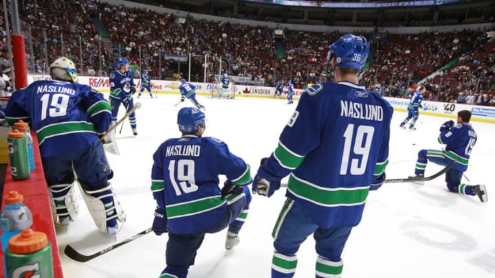 VANCOUVER, CANADA - DECEMBER 11: Members of the Vancouver Canucks sport Markus Naslund jerseys as they skate in the warmup before their game against the Tampa Bay Lightning at Rogers Arena on December 11, 2010 in Vancouver, British Columbia, Canada. The Canucks honoured Naslund by retiring his jersey before the start of the game. (Photo by Jeff Vinnick/NHLI via Getty Images)