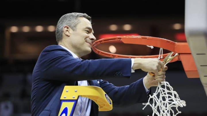 LOUISVILLE, KENTUCKY - MARCH 30: Head coach Tony Bennett of the Virginia Cavaliers celebrates after defeating the Purdue Boilermakers 80-75 in overtime of the 2019 NCAA Men's Basketball Tournament South Regional to advance to the Final Four at KFC YUM! Center on March 30, 2019 in Louisville, Kentucky. (Photo by Andy Lyons/Getty Images)