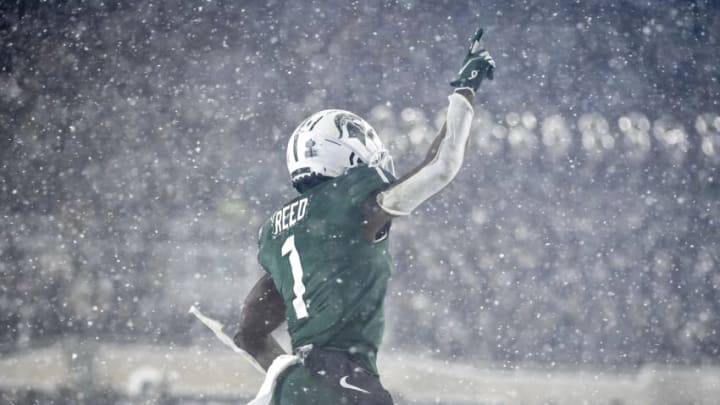 EAST LANSING, MICHIGAN - NOVEMBER 27: Jayden Reed #1 of the Michigan State Spartans celebrates scoring a touchdown against the Penn State Nittany Lions during the fourth quarter at Spartan Stadium on November 27, 2021 in East Lansing, Michigan. (Photo by Nic Antaya/Getty Images)