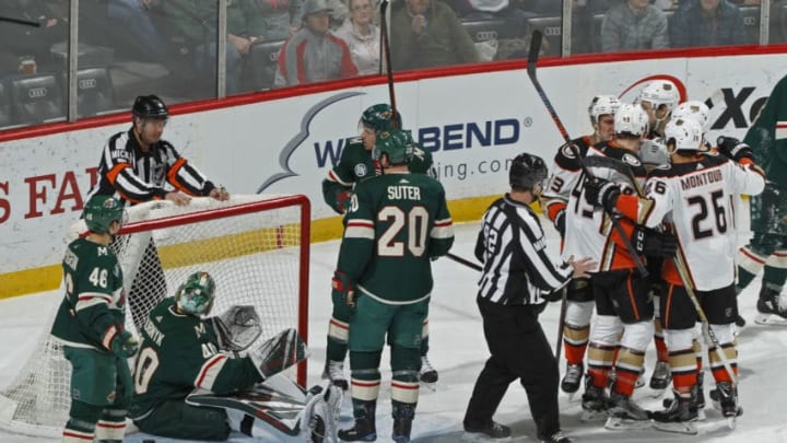 ST. PAUL, MN - FEBRUARY 19: Jared Spurgeon #46 of the Minnesota Wild, Devan Dubnyk #40 of the Minnesota Wild, Ryan Suter #20 of the Minnesota Wild and Zach Parise #11 of the Minnesota Wild can only look at the referee as Brandon Montour #26 of the Anaheim Ducks and Max Jones #49 of the Anaheim Ducks congratulate Jakob Silfverberg #33 of the Anaheim Ducks on his 2nd period power play goal during a game at Xcel Energy Center on February 19, 2019 in St. Paul, Minnesota.(Photo by Bruce Kluckhohn/NHLI via Getty Images)