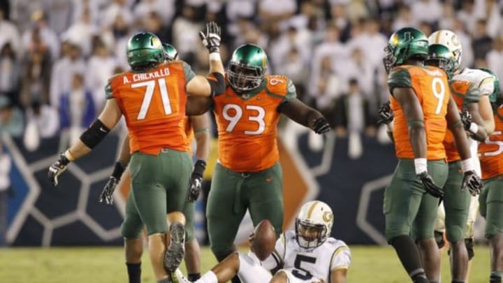 Oct 4, 2014; Atlanta, GA, USA; Miami Hurricanes defensive lineman Anthony Chickillo (71) and defensive lineman Calvin Heurtelou (93) celebrate after tackling Georgia Tech Yellow Jackets quarterback Justin Thomas (5) in the third quarter at Bobby Dodd Stadium. Georgia Tech defeated Miami 28-17. Mandatory Credit: Brett Davis-USA TODAY Sports