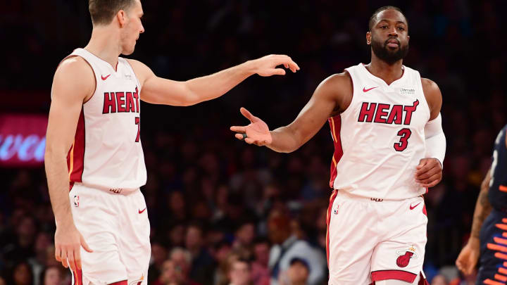 NEW YORK, NEW YORK – MARCH 30: Dwyane Wade #3 of the Miami Heat high-fives teammate Goran Dragic #7 during the second half of the game against the New York Knicks at Madison Square Garden on March 30, 2019 in New York City. NOTE TO USER: User expressly acknowledges and agrees that, by downloading and or using this photograph, User is consenting to the terms and conditions of the Getty Images License Agreement. (Photo by Sarah Stier/Getty Images)