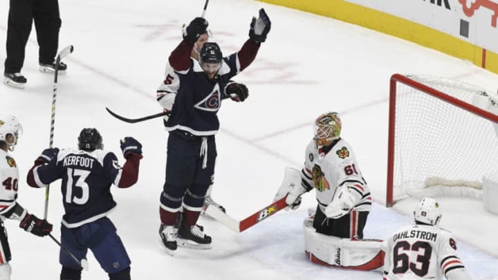 DENVER, CO - DECEMBER 29: Colorado Avalanche left wing Gabriel Landeskog (92) and Colorado Avalanche center Alexander Kerfoot (13) celebrate Colorado Avalanche center Nathan MacKinnon's goal (not pictured) in the second period against Chicago Blackhawks goaltender Collin Delia (60) at the Pepsi Center December 29, 2018. (Photo by Andy Cross/The Denver Post via Getty Images)