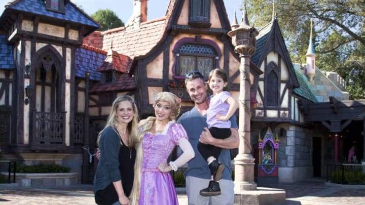 ANAHEIM, CA - MARCH 06: In this handout image provided by Disney Parks, Sarah Michelle Gellar, Freddie Prinze Jr. and their daughter Charlotte, 3, meet Rapunzel at the all-new "Fantasy Faire" attraction at Disneyland on March 6, 2013 in Anaheim, California."Fantasy Faire," which opens March 12, is an enchanting, immersive storybook world that brings Disney Princesses and their timeless tales to life. (Photo by Paul Hiffmeyer/ Disney Enterprises, Inc. via Getty Images)