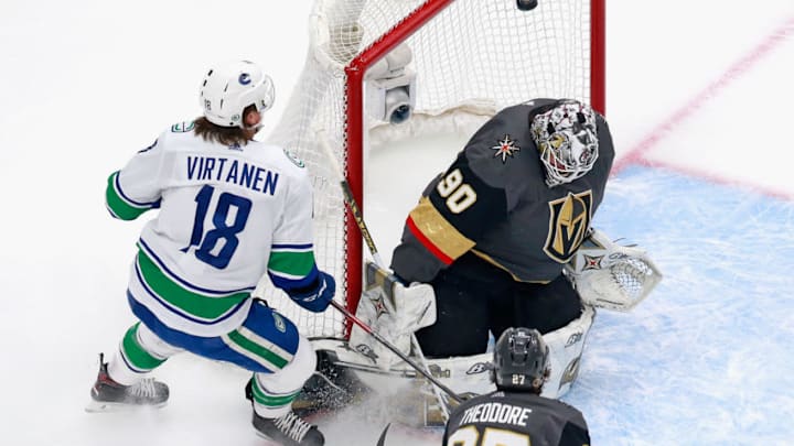 EDMONTON, ALBERTA - AUGUST 23: Jake Virtanen #18 of the Vancouver Canucks watches a first period shot miss the net against Robin Lehner #90 of the Vegas Golden Knights in Game One of the Western Conference Second Round during the 2020 NHL Stanley Cup Playoffs at Rogers Place on August 23, 2020 in Edmonton, Alberta, Canada. (Photo by Jeff Vinnick/Getty Images)