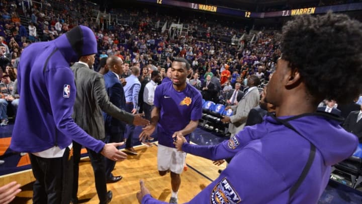 PHOENIX, AZ - NOVEMBER 16: TJ Warren #12 of the Phoenix Suns gets introduced before the game against the Houston Rockets on November 16, 2017 at Talking Stick Resort Arena in Phoenix, Arizona. NOTE TO USER: User expressly acknowledges and agrees that, by downloading and or using this photograph, user is consenting to the terms and conditions of the Getty Images License Agreement. Mandatory Copyright Notice: Copyright 2017 NBAE (Photo by Barry Gossage/NBAE via Getty Images)