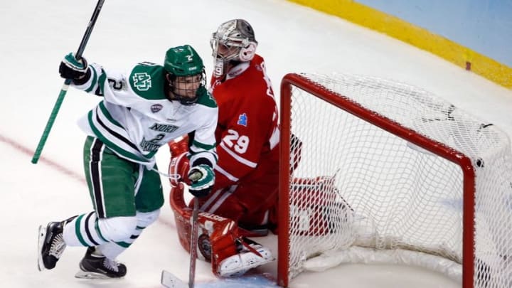 Apr 9, 2015; Boston, MA, USA; University of North Dakota defenseman Troy Stecher (2) reacts after scoring a goal on Boston University Terriers goalie Matt O'Connor (29) during the third period in a semifinal game in the men's Frozen Four college ice hockey tournament at TD Garden. Mandatory Credit: Greg M. Cooper-USA TODAY Sports