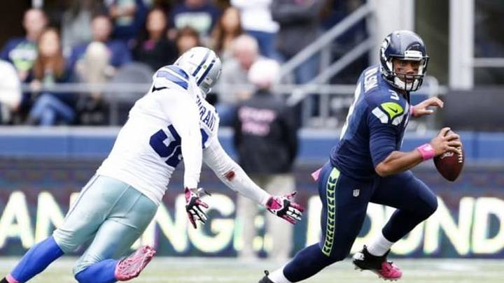 Oct 12, 2014; Seattle, WA, USA; Seattle Seahawks quarterback Russell Wilson (3) scrambles out of the pocket against the Dallas Cowboys during the fourth quarter of a 26-20 Dallas victory at CenturyLink Field. Mandatory Credit: Joe Nicholson-USA TODAY Sports