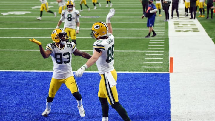 DETROIT, MICHIGAN - DECEMBER 13: Robert Tonyan #85 of the Green Bay Packers celebrates scoring a fourth quarter touchdown against the Detroit Lions at Ford Field on December 13, 2020 in Detroit, Michigan. (Photo by Nic Antaya/Getty Images)