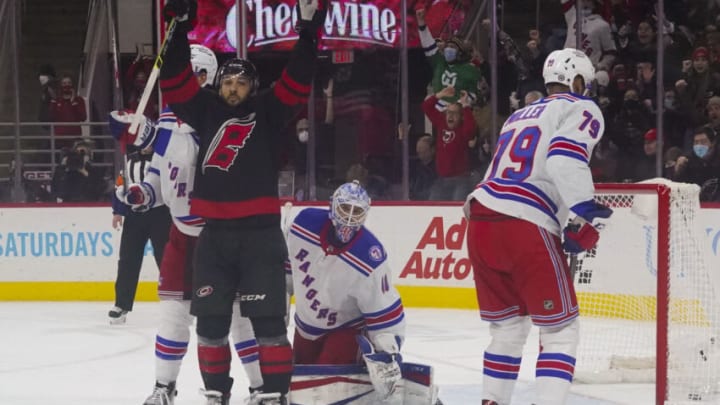 Jan 21, 2022; Raleigh, North Carolina, USA; Carolina Hurricanes center Vincent Trocheck (16) celebrates his goal against New York Rangers goaltender Alexandar Georgiev (40) during the first period at PNC Arena. Mandatory Credit: James Guillory-USA TODAY Sports
