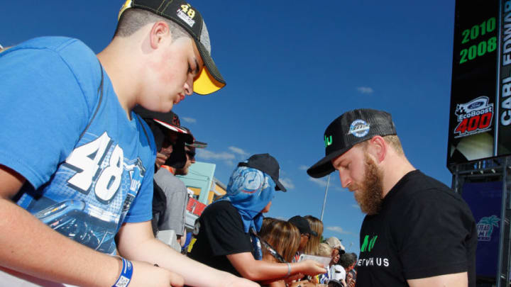 HOMESTEAD, FL - NOVEMBER 19: Jeffrey Earnhardt, driver of the #33 hulu Chevrolet, signs autographs prior to the driver's meeting for the Monster Energy NASCAR Cup Series Championship Ford EcoBoost 400 at Homestead-Miami Speedway on November 19, 2017 in Homestead, Florida. (Photo by Brian Lawdermilk/Getty Images)