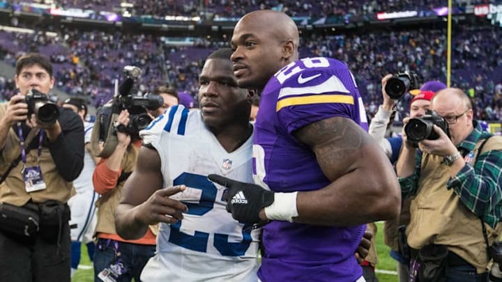 Dec 18, 2016; Minneapolis, MN, USA; Minnesota Vikings running back Adrian Peterson (28) and Indianapolis Colts running back Frank Gore (23) at U.S. Bank Stadium. The Colts defeated the Vikings 34-6. Mandatory Credit: Brace Hemmelgarn-USA TODAY Sports