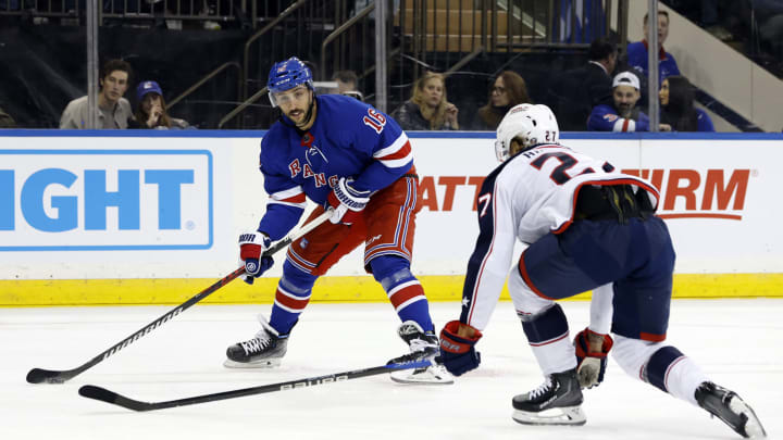NEW YORK, NEW YORK – NOVEMBER 12: Vincent Trocheck #16 of the New York Rangers controls the puck as Adam Boqvist #27 of the Columbus Blue Jackets defends during the second period at Madison Square Garden on November 12, 2023 in New York City. (Photo by Sarah Stier/Getty Images)