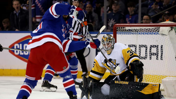 Mar 25, 2022; New York, New York, USA; New York Rangers center Frank Vatrano (77) scores a goal against Pittsburgh Penguins goaltender Tristan Jarry (35) during the first period at Madison Square Garden. Mandatory Credit: Brad Penner-USA TODAY Sports