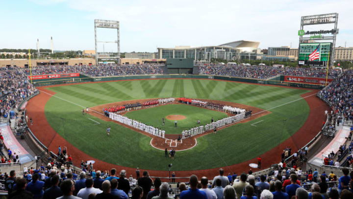 OMAHA, NEBRASKA - JUNE 13: A general view as the players from each of the 8 College World Series teams line up with the Detroit Tigers and the Kansas City Royals during the National Anthem ahead of the game at TD America Park on June 13, 2019 in Omaha, Nebraska. (Photo by Jamie Squire/Getty Images)