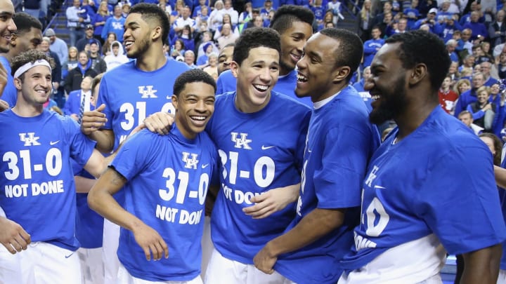 LEXINGTON, KY – MARCH 07: Tyler Ulis #3, Devin Booker #1, EJ Floreal #24 and Dominique Hawkins #25 of the Kentucky Wildcats celebrate following the game against the Florida Gators at Rupp Arena on March 7, 2015 in Lexington, Kentucky. Kentucky won 67-50 to finish the regular 31-0. (Photo by Andy Lyons/Getty Images)