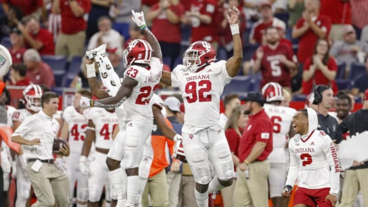 INDIANAPOLIS, IN - AUGUST 31: Jaylin Williams #23 and Alfred Bryant #92 of the Indiana Hoosiers celebrate after an interception during the second half sealing the game over the Ball State Cardinals at Lucas Oil Stadium on August 31, 2019 in Indianapolis, Indiana. (Photo by Michael Hickey/Getty Images)