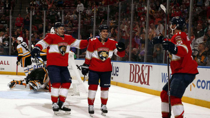 SUNRISE, FL - OCT. 22: Denis Malgin #62 of the Florida Panthers celebrates his goal with teammates Jonathan Huberdeau #11 and Evgeni Dadonov #63 during the second period against the Pittsburgh Penguins at the BB&T Center on October 22, 2019 in Sunrise, Florida. (Photo by Eliot J. Schechter/NHLI via Getty Images)