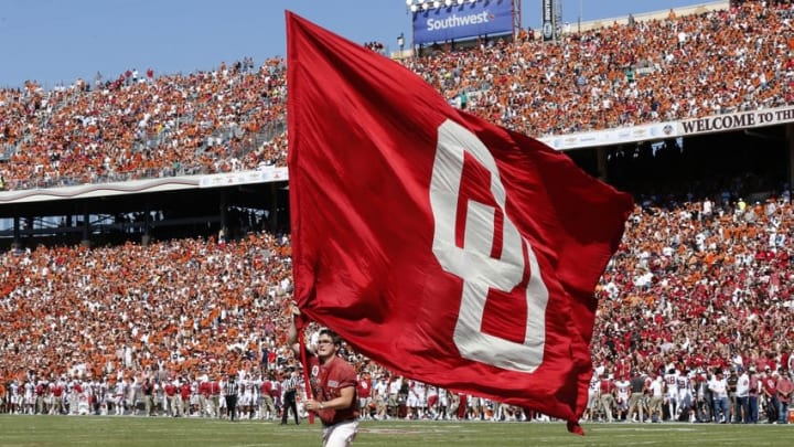 Oct 10, 2015; Dallas, TX, USA; Oklahoma Sooners ruf-nek carries an Oklahoma flag after a score against the Texas Longhorns during Red River rivalry at Cotton Bowl Stadium. Mandatory Credit: Matthew Emmons-USA TODAY Sports