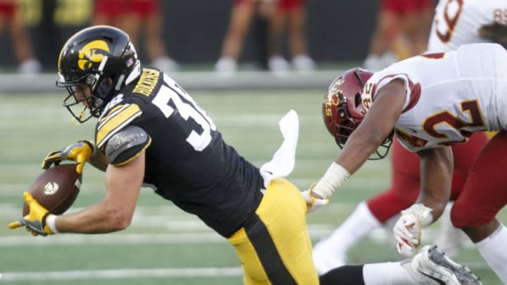 IOWA CITY, IOWA- SEPTEMBER 08: Tight end T.J. Hockenson #38 of the Iowa Hawkeyes catches a pass during the second half in front of linebacker Marcel Spears #42 of the Iowa State Cyclones on September 8, 2018 at Kinnick Stadium, in Iowa City, Iowa. (Photo by Matthew Holst/Getty Images)